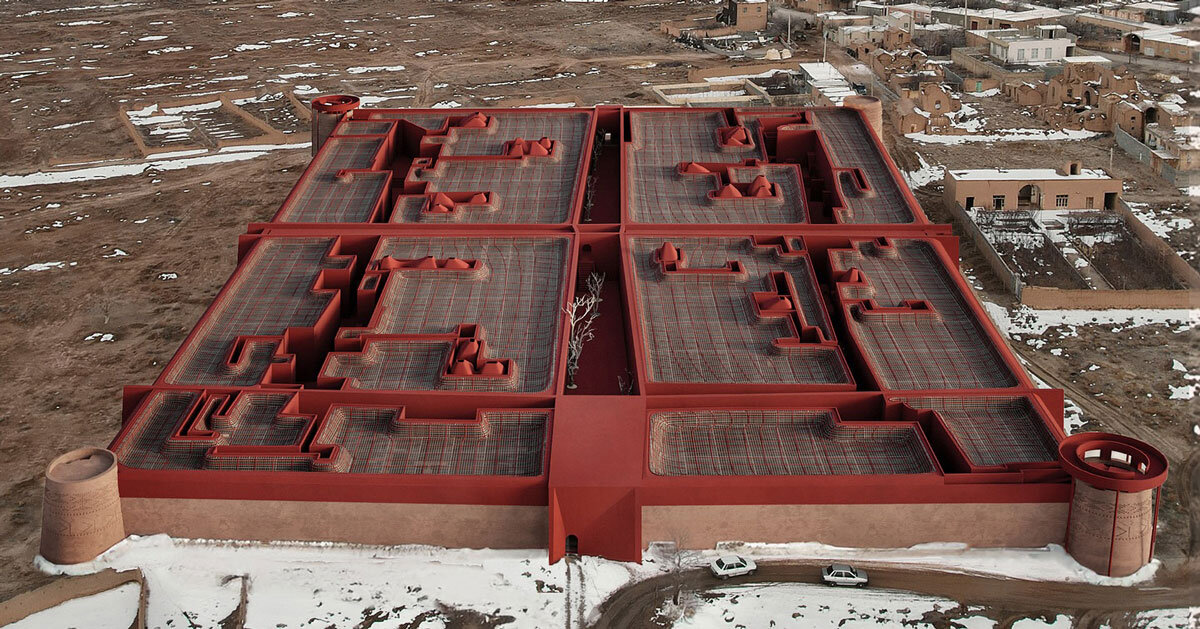 kalbod reimagines ernan castle in iran as boutique hotel enclosed in red textured walls