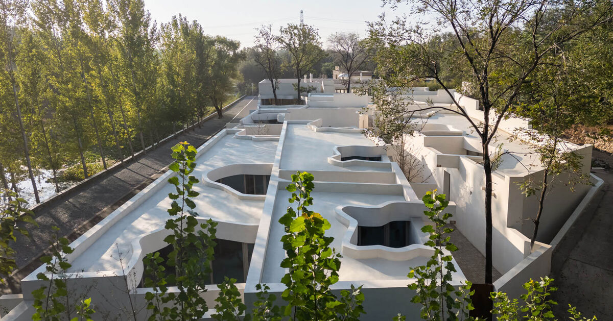 cluster of interwoven white courtyard houses reinterprets ancient kilns for resort in china