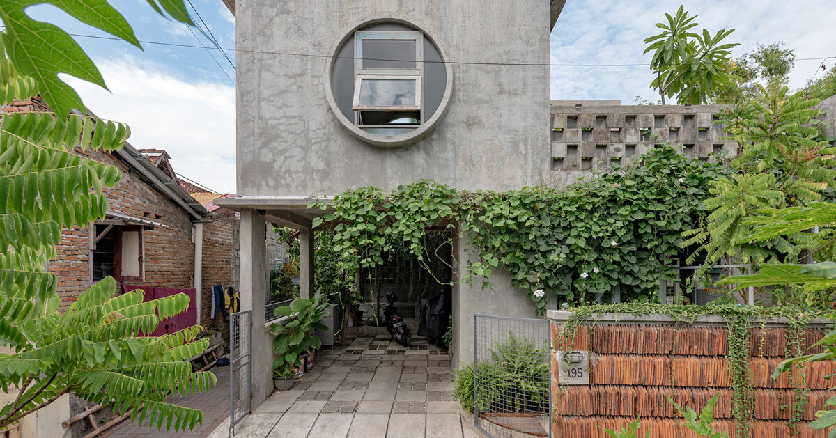 urban concrete home in indonesia opens between four green gardens