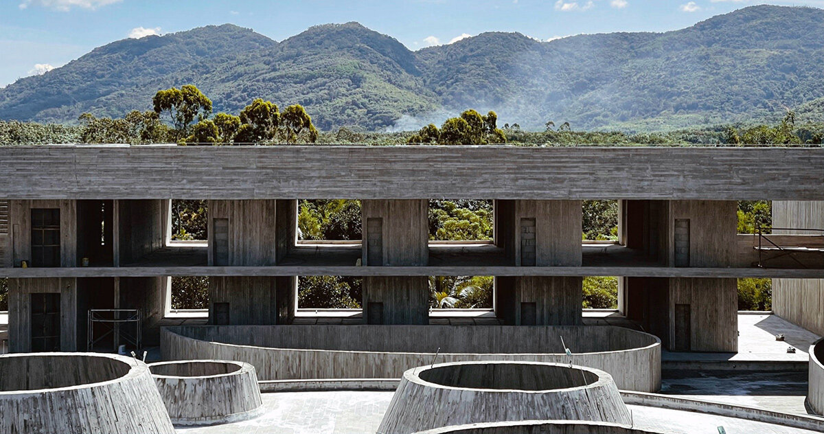 rainwater cascades in thin curtains within synchronicity's 'rain house' in hainan