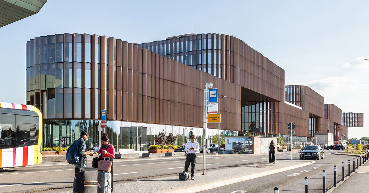 BIG’s timber ‘snakes’ rise as skypark business center nears completion in luxembourg