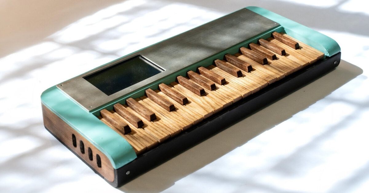 cardboard synthesizer plays sounds using handmade wooden keys cut from walnut and oak
