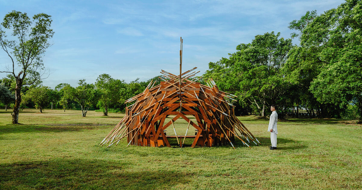 interlocking bamboo and cedar frames shape wild boar nest installation by cheng tsung feng