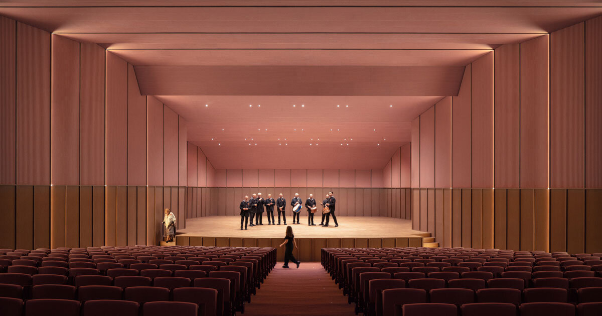 bright pink interior revitalizes adaptive acoustic music hall for sax’s cultural complex in spain