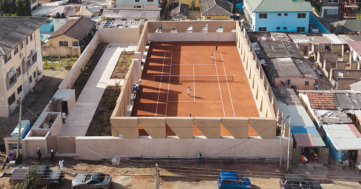 ghana's first precast rammed earth project by deroche projects hosts community tennis court