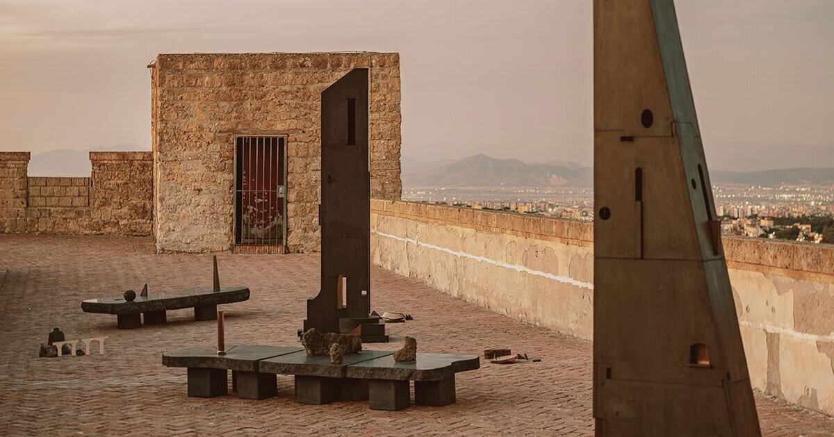 totemic sculptures compose volcanic stone landscape for site-specific installation in naples