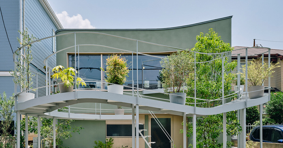looping terrace arcs toward the street to bring daylight inside a tokyo dwelling by HOAA