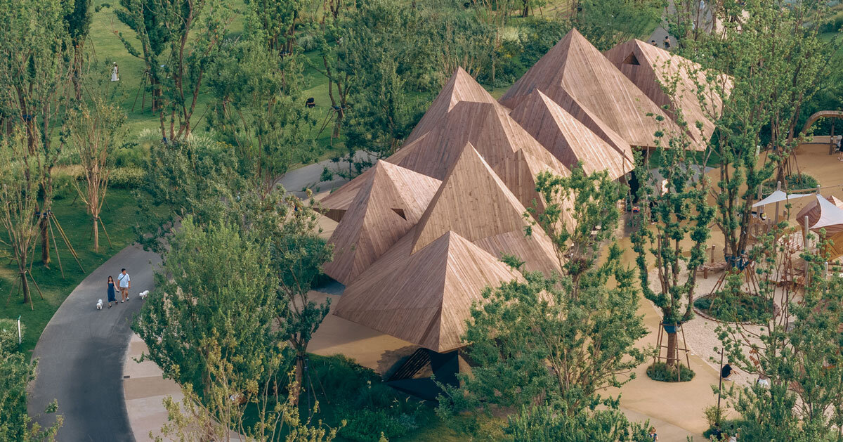 pyramidal volumes with wood strip patterns frame luxeisland restaurant by DL atelier
