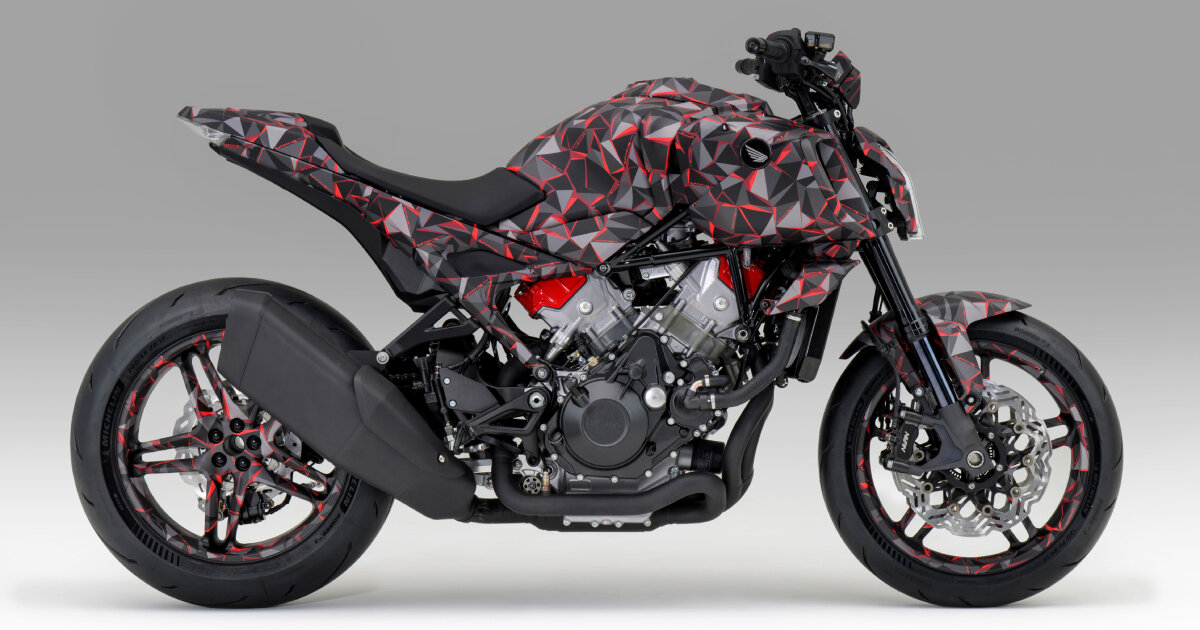 naked motorcycle by honda exposes the engine around the camouflage-wrapped frame