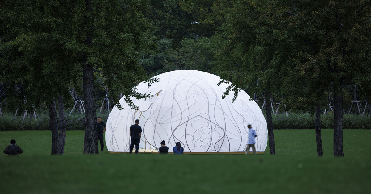 translucent illuminating dome bears bronze lattice of flower motifs in shanghai