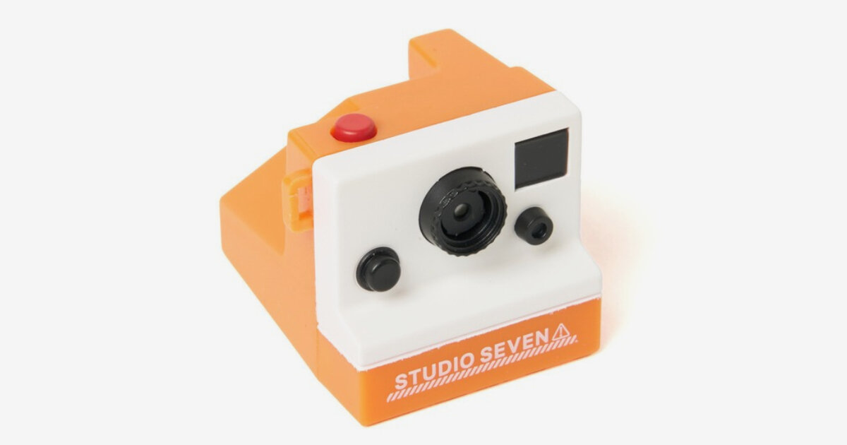 palm-sized retro digital toy camera hooks around belts or bags for portable picture-taking