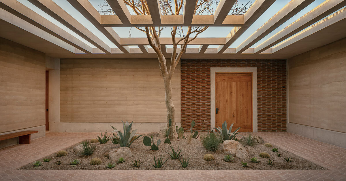 rammed-earth residence unfolds around central planted courtyard on mexico's coast