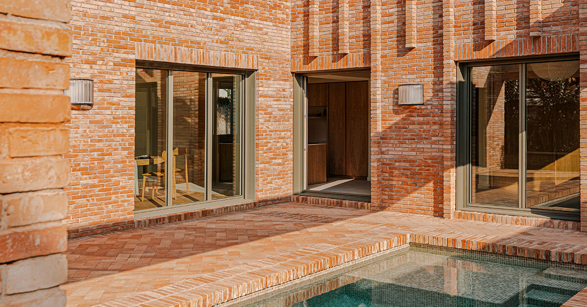 SIGLA studio organizes brick residence around two ‘lungs’ of light in spain
