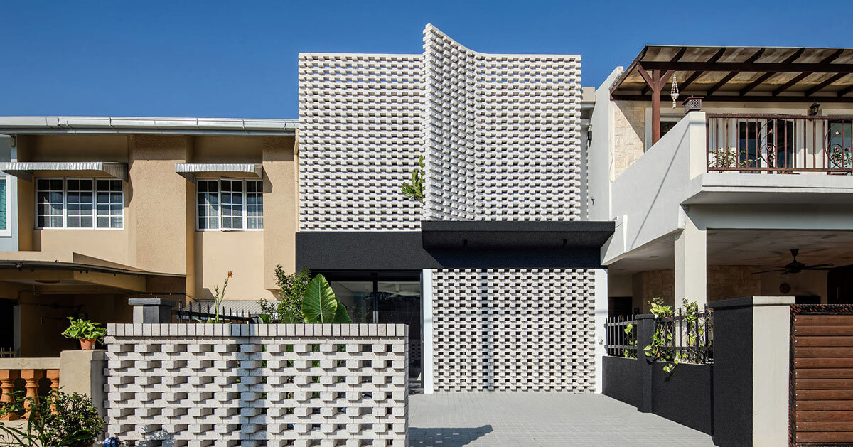 porous white brickwork facade enfolds renovated 1980s terrace house in kuala lumpur