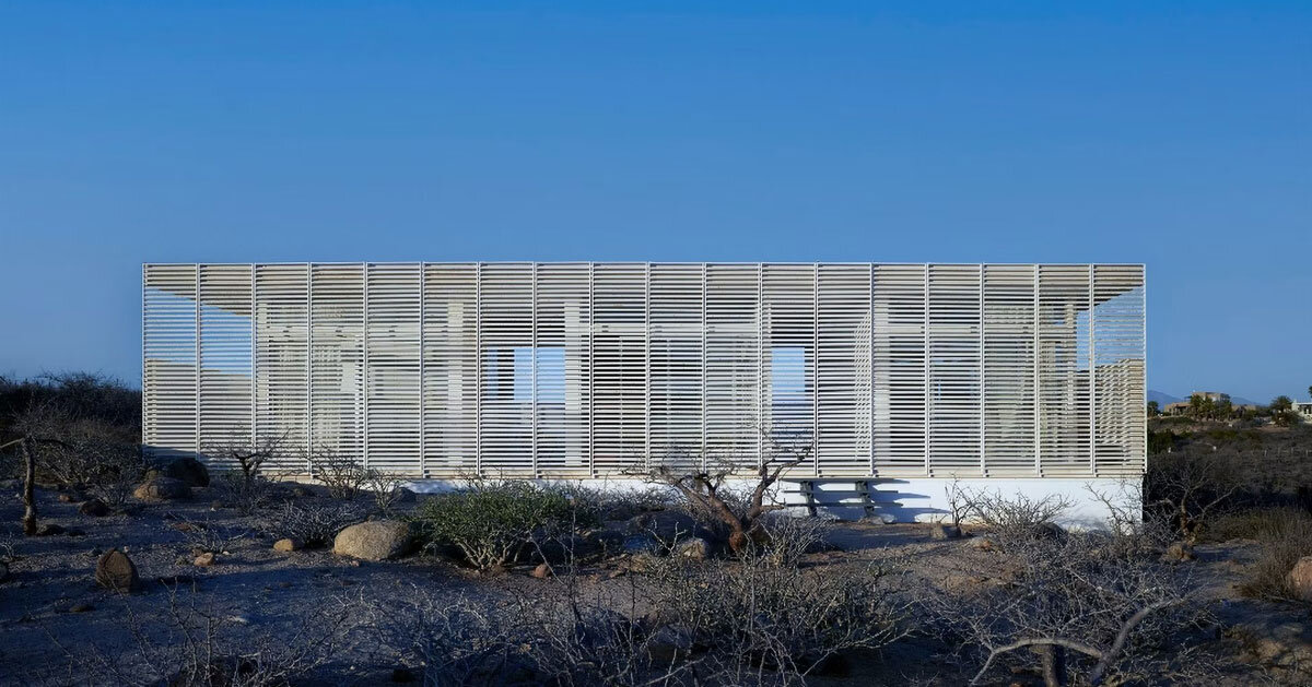 white louvers craft perforated facade filtering daylight within casa nada’s interiors in mexico