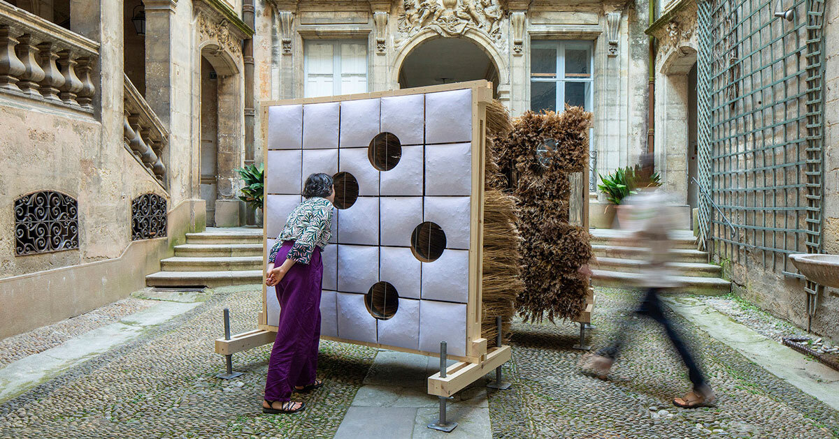 mirroring pillowed walls filled with reed grass compose sensory installation in montpellier