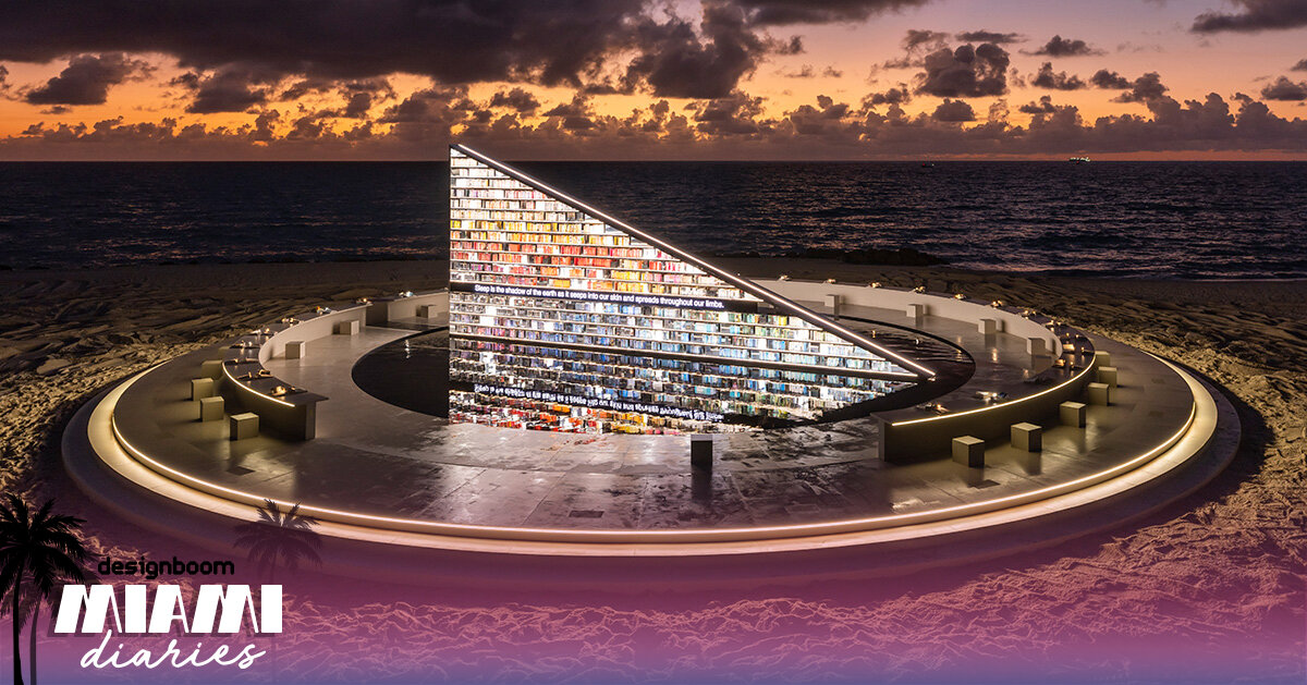 es devlin's triangular bookshelf rotates within a mirrored pool for miami art week 2025