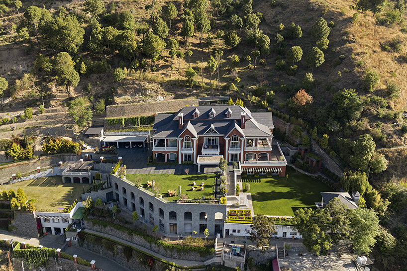 stepped residence embedded into the hillside maximizes views and privacy in india