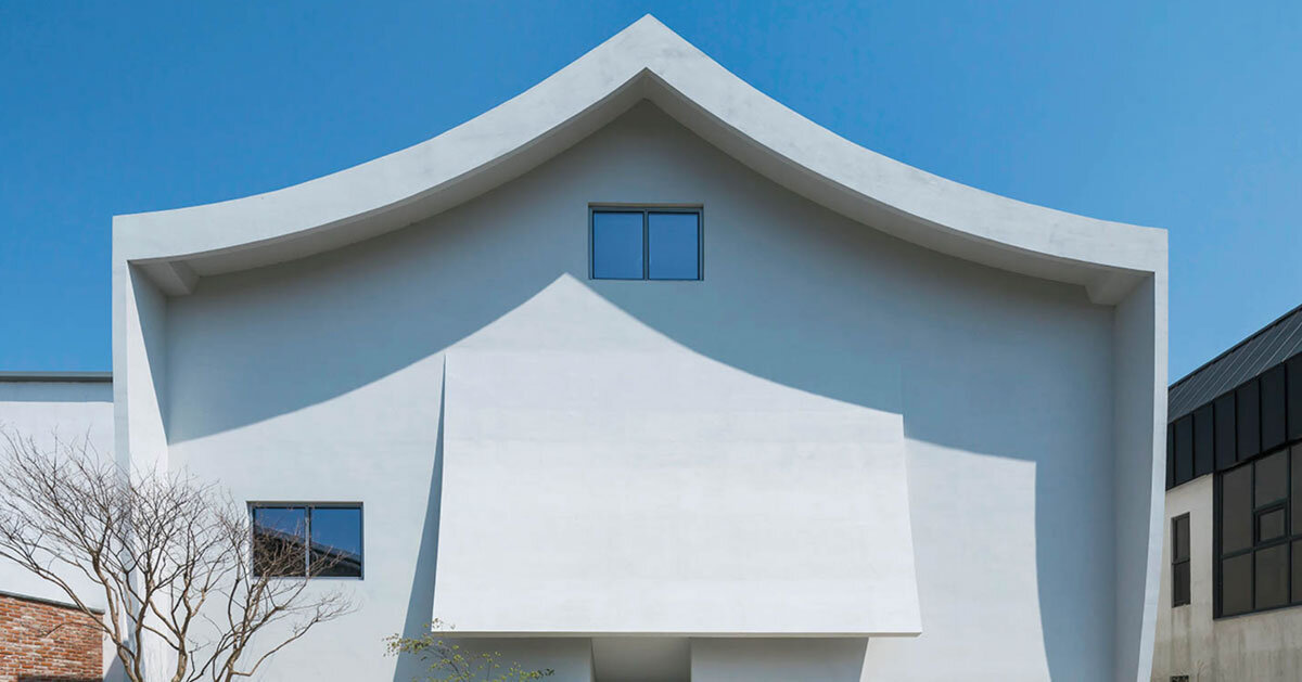 curved eave roofs shape IROJE KHM's white lakeside residence in south korea