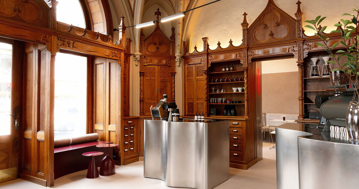 laboratorium cafe opens within revived neo-gothic apothecary in romania