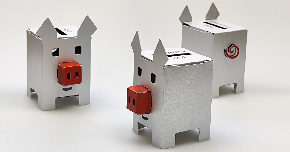 metallic piggy bank made of paper encourages young people to save money and donate
