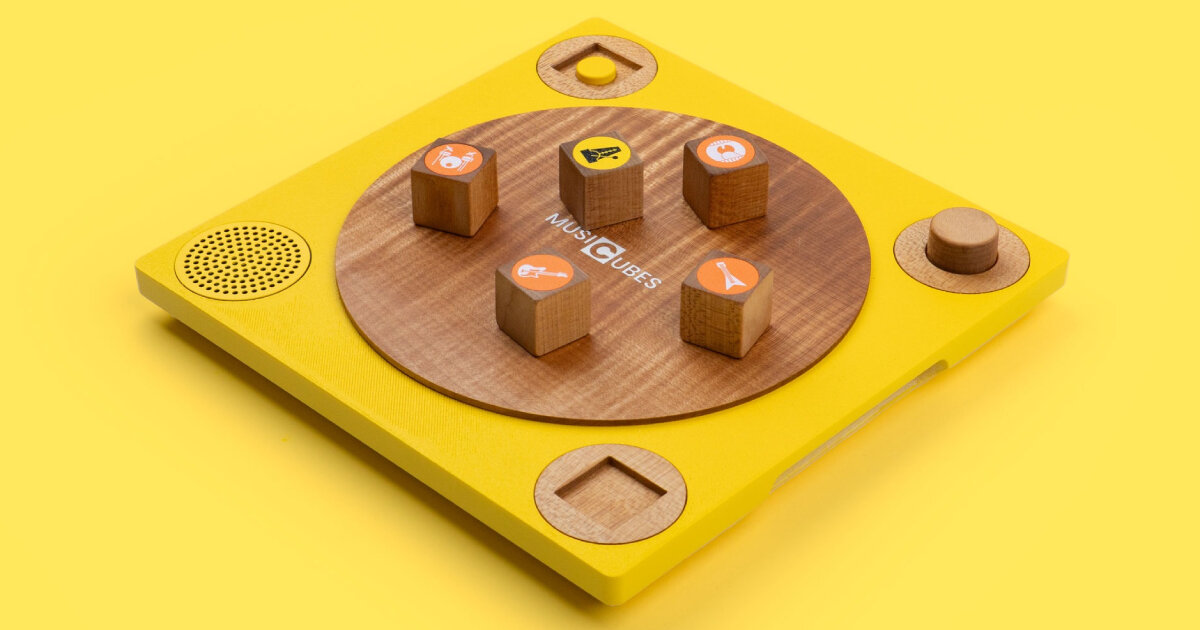 musical wooden cubes produce instrumental sounds when placed on smart vinyl-like board
