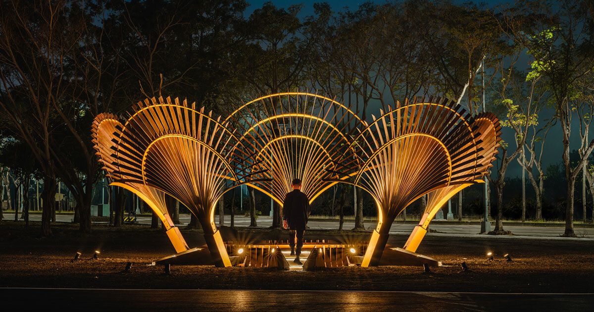 bent wooden beams fan like illuminating petals in cheng tsung feng's installation in taiwan
