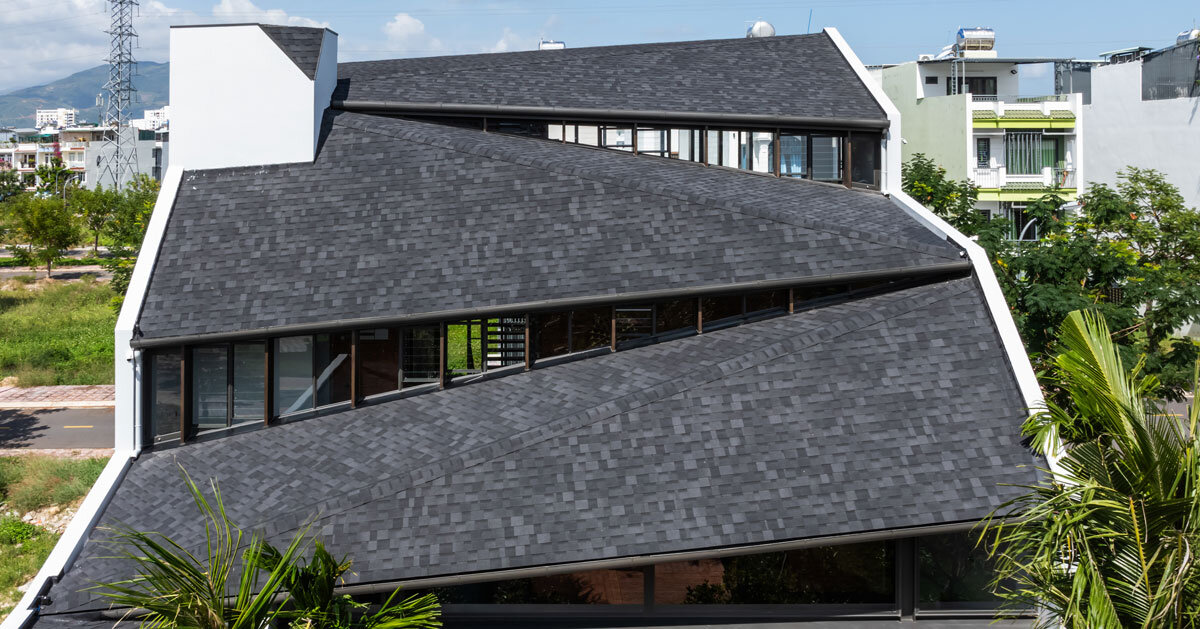 tent house expands under overlapping angular roof planes in vietnam