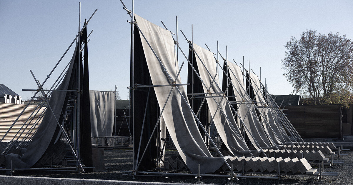 concrete canvas wraps 18 scaffolding monoliths for monumental installation in florence