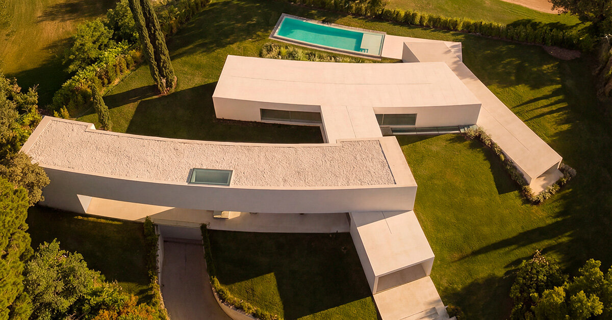 curved bodies organize sequence of gardens in spanish home by fran silvestre arquitectos