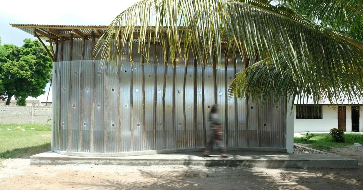 perforated corrugated panels regulate light and ventilation at library in tanzania