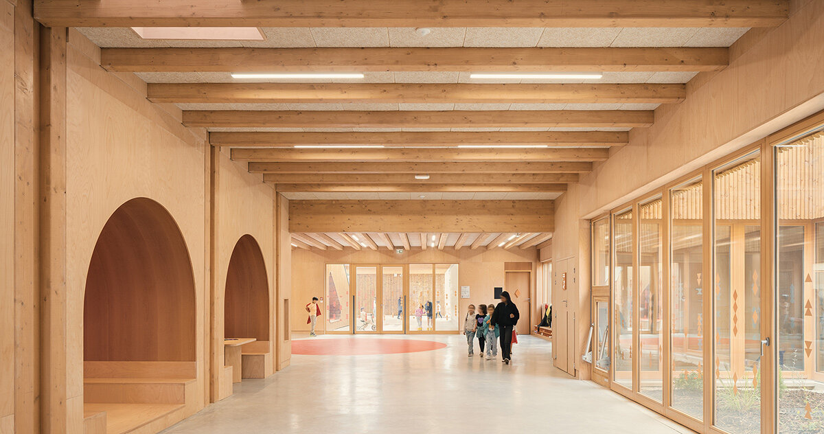 le penhuel & associes designs french school with ubiquitous wooden interiors