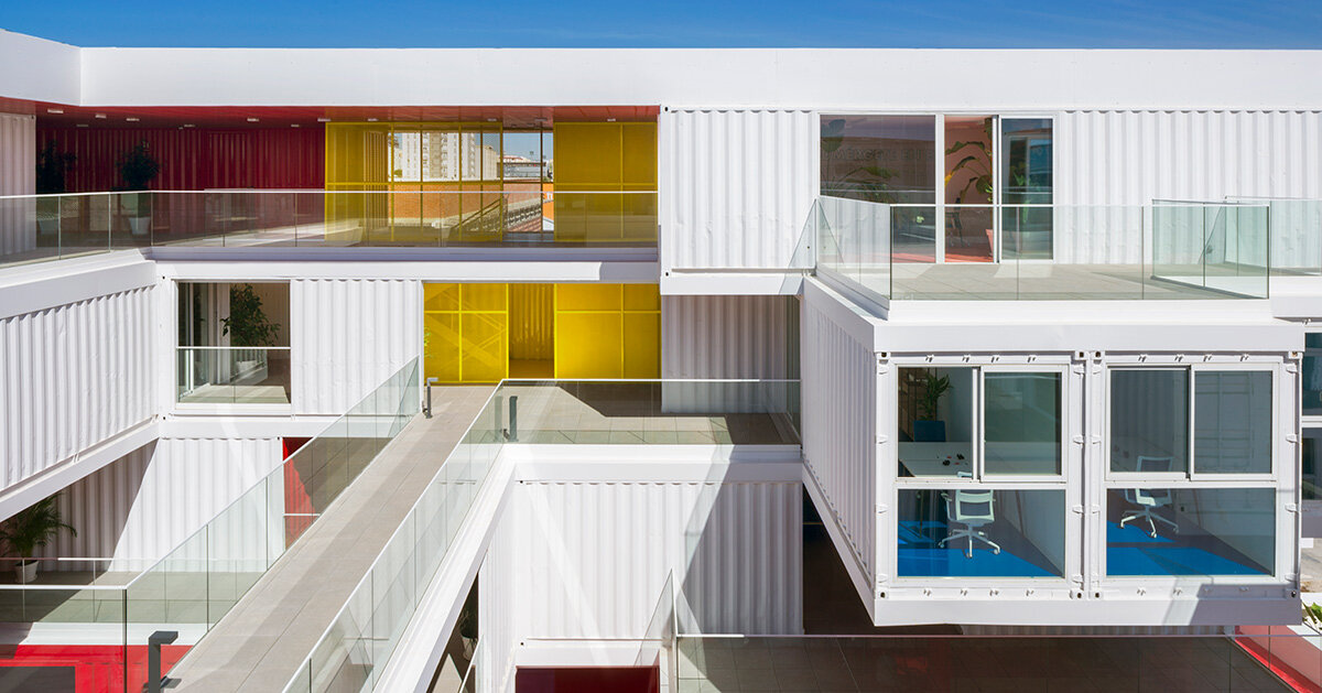 reused shipping containers form high-tech incubator by carquero arquitectura in spain