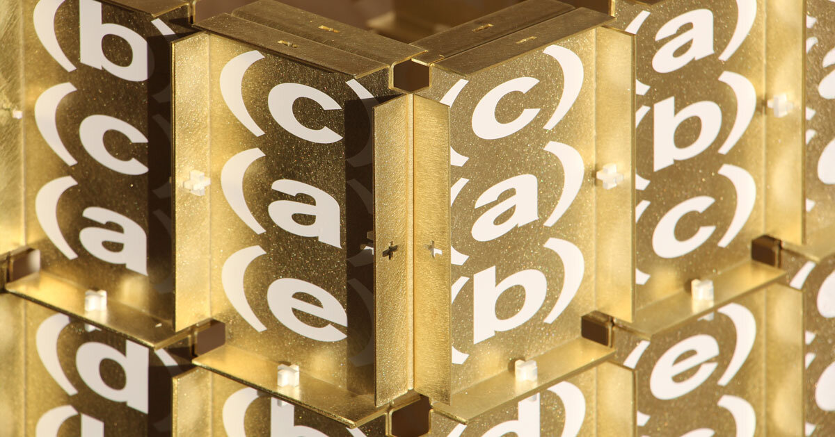 letters printed across brass chair turn mathematical paradox into NYC political commentary