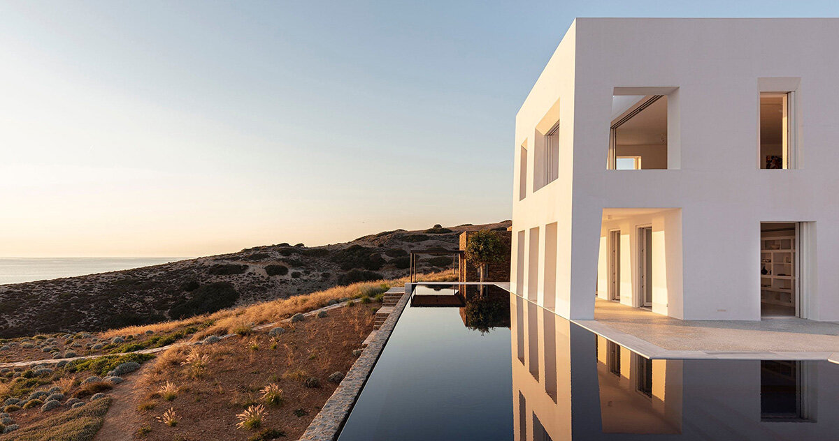 monolithic white ‘avlakia house’ overlooks rugged island of antiparos, greece