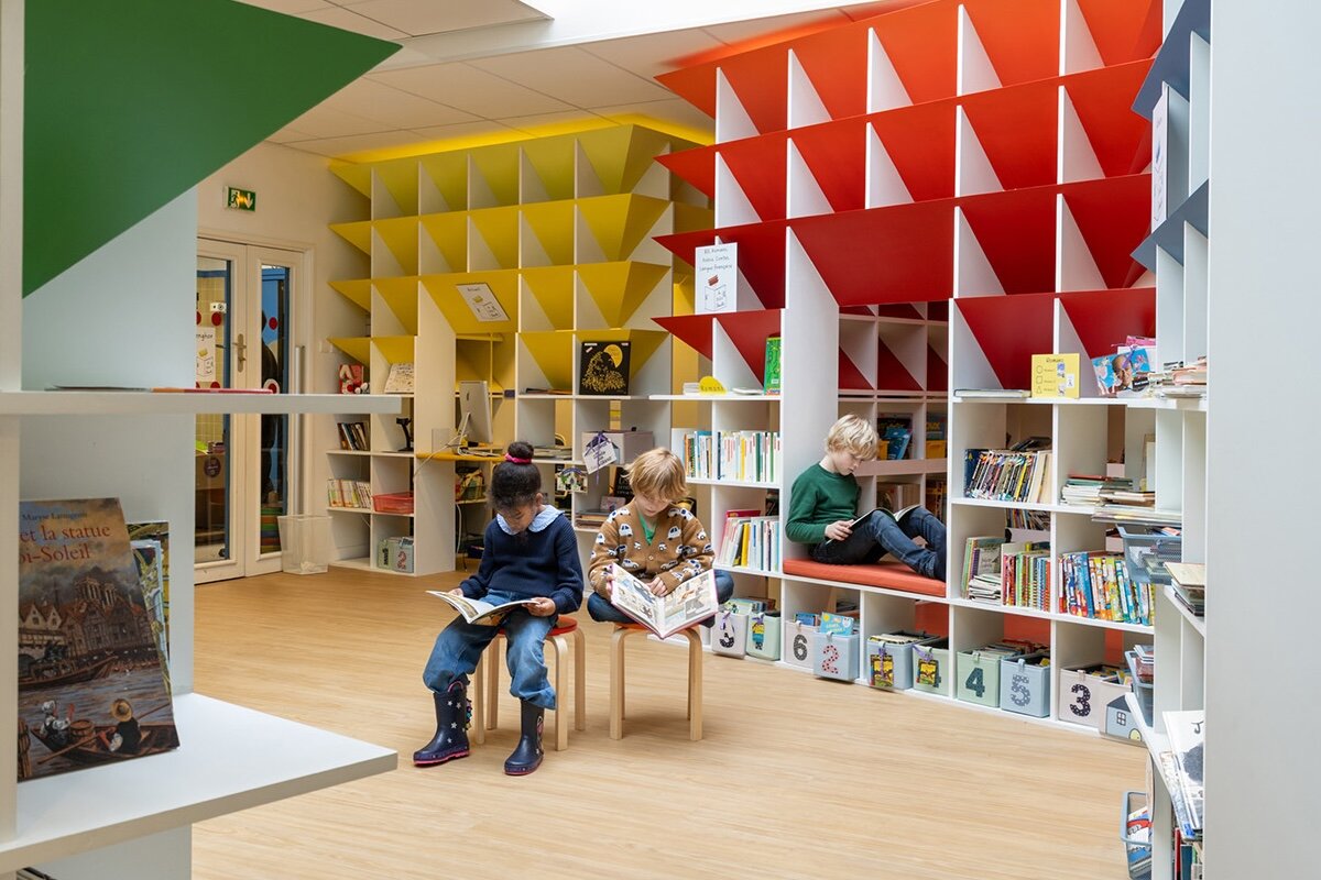 children can get lost in reading village full of colorful huts at transformed paris school library