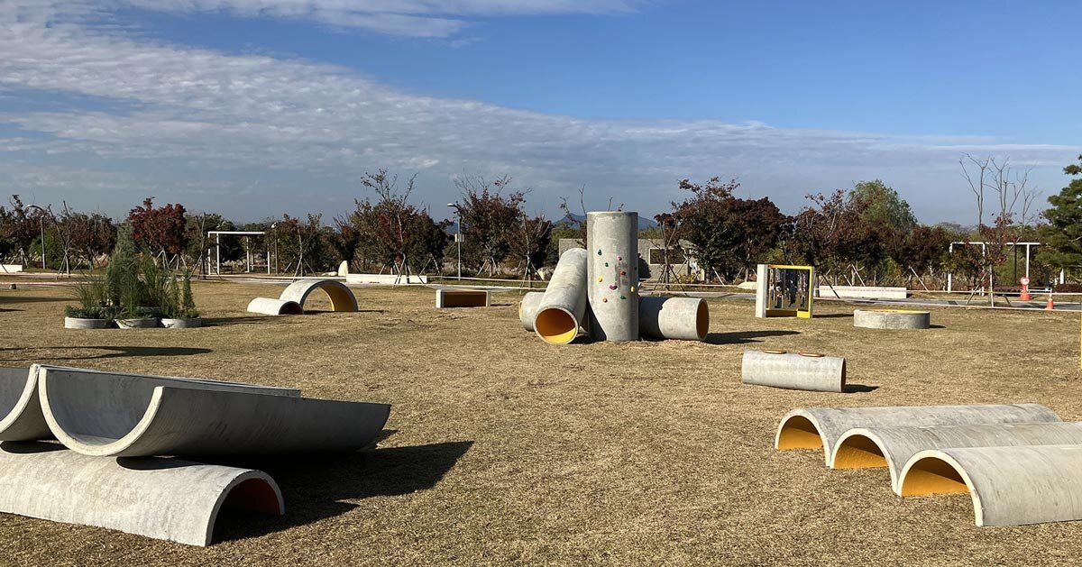 concrete utopia transforms discarded construction pipes into playground in south korea