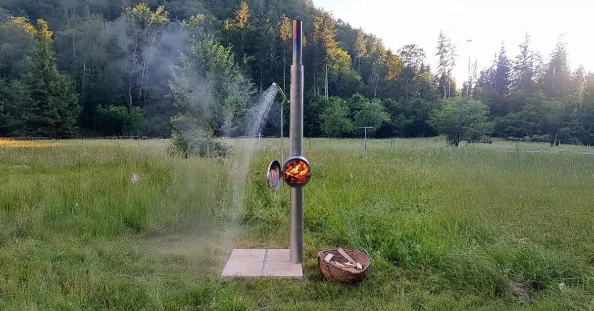 garden shower made of steel uses integrated wood stove to heat up the water