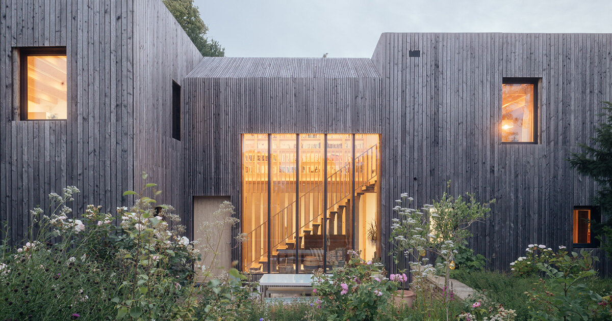 studio bark shapes low carbon 'orchard house' as two silvery larch-clad cubes