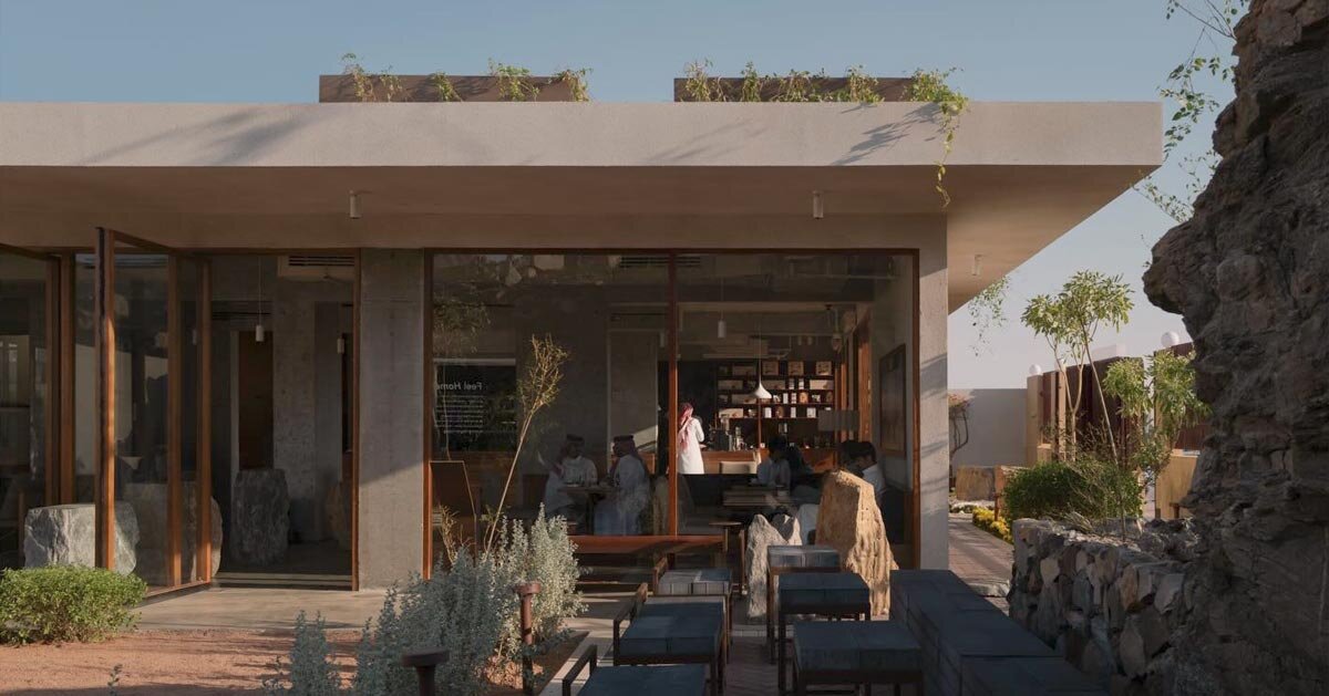 open planted courtyard organizes a café carved directly into rock in saudi arabia
