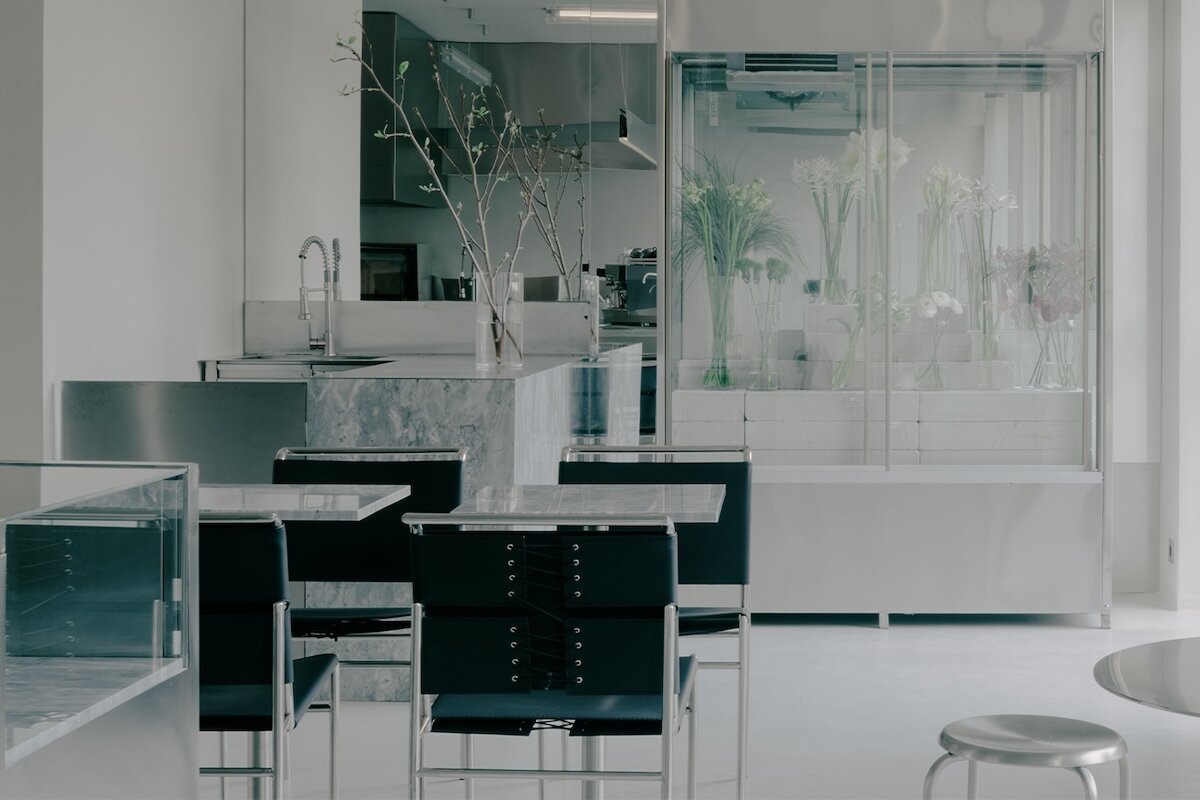 stainless steel and concrete build futuristic backdrop for tbilisi flower shop and cafe