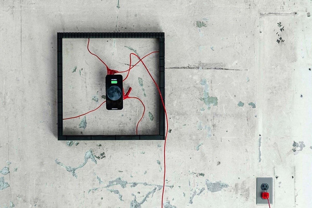 viewers activate this beating heart art installation by charging their smartphone