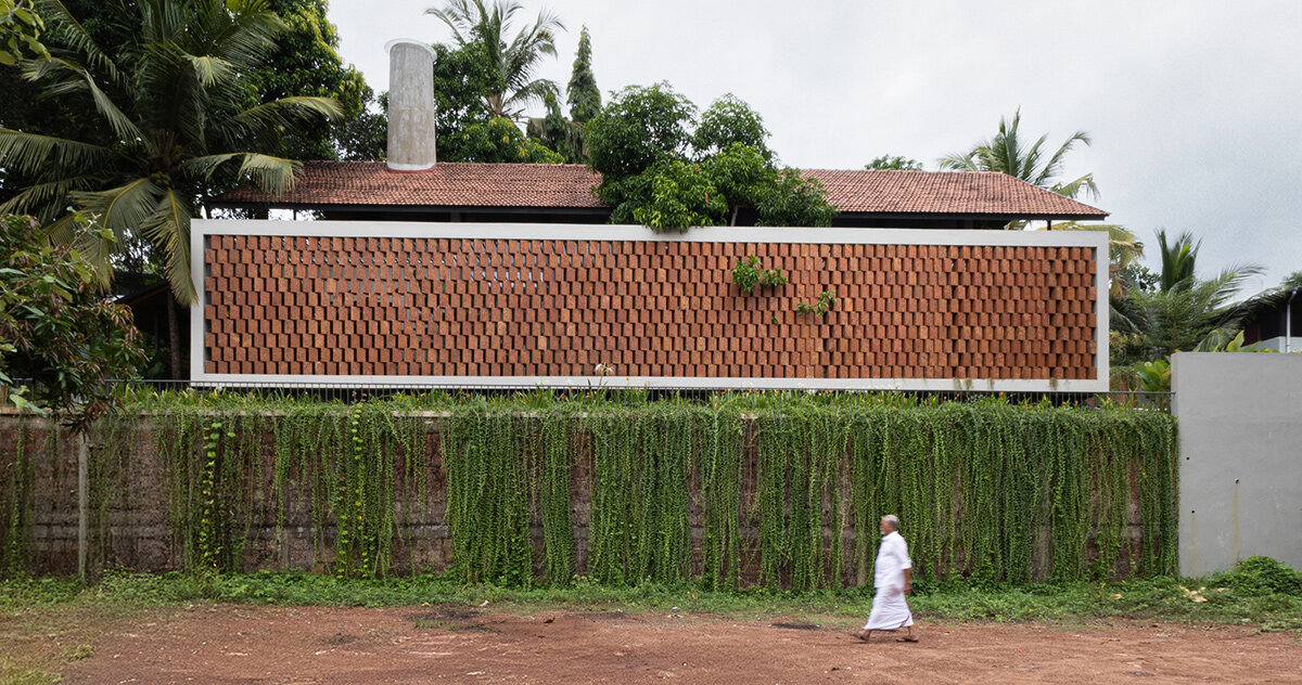 zero studio's haven house features tropical gardens enclosed by breezy brickwork