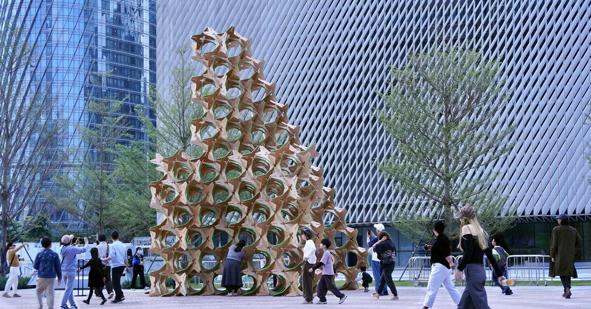 hundreds of interlocking star modules build a porous timber installation