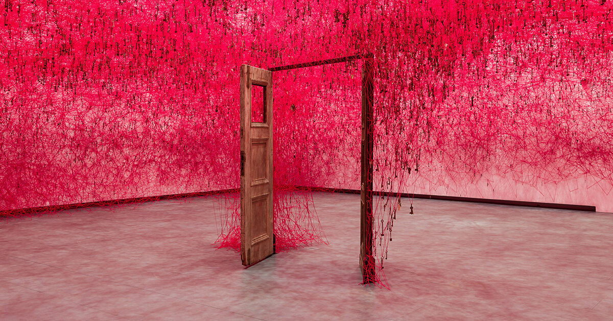 chiharu shiota's woven webs meet yin xiuzhen's clothing installations at hayward gallery