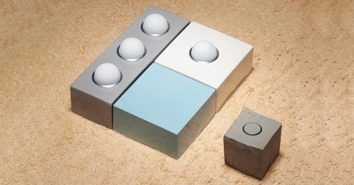 egg-shaped bulbs tucked in ceramic bricks light up around modular wall and chair lamp