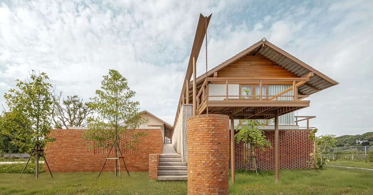 brick and concrete sculpt elevated riverfront residence in thailand by bodinchapa architects
