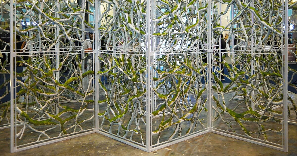 recycled paper waste turns into a branch-like lattice in a living spatial installation