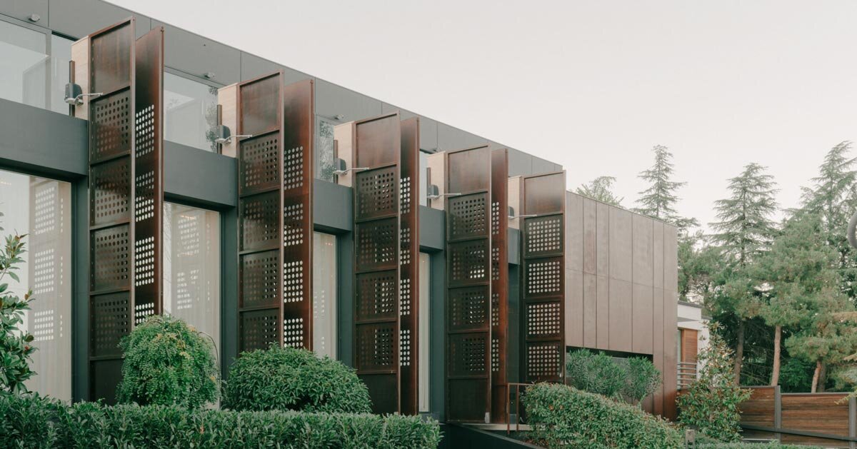 punctured iron doors shape kinetic facade by TIMM architecture in tbilisi