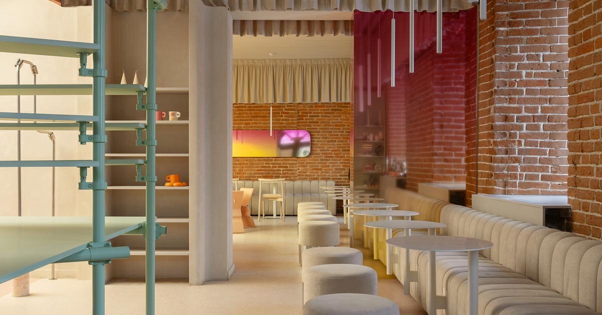 curved pink interiors animate hybrid retail-cafe space within brick shell